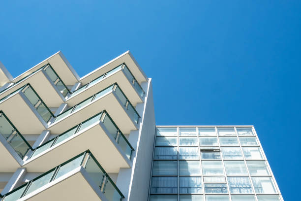 istock Facade of modern building under blue sky 1427569257
