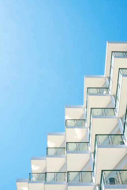 istock Facade of modern building under blue sky 1427569262