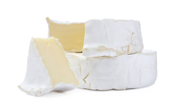 istock Tasty cut and whole brie cheeses on white background 1427569560
