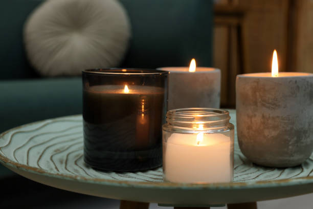 istock Lit candles on table in living room 1427571348