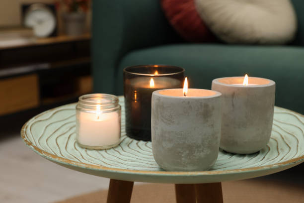 istock Lit candles on table in living room 1427571795