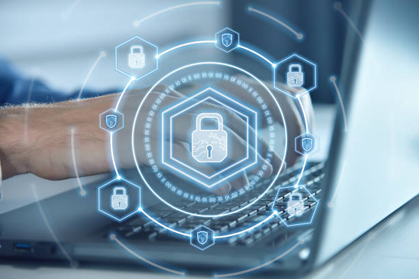 istock Businessman using laptop and digital lock icon hologram with digital shield 1427573405