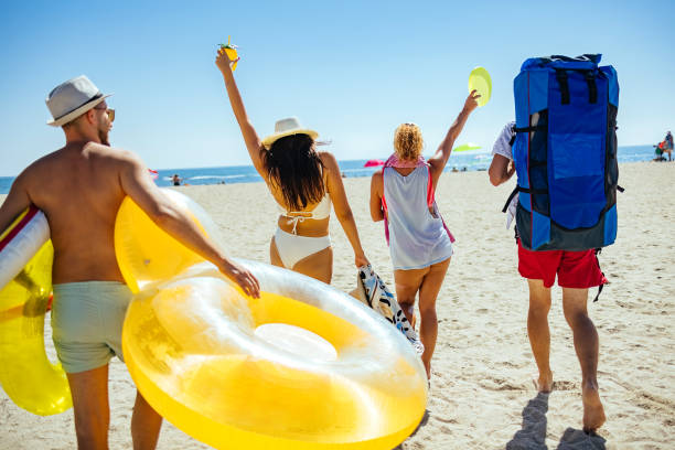 hot of a group of friends spending time together at the beach