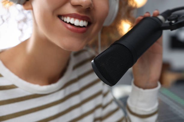 istock Woman working as radio host in modern studio, closeup 1427575432
