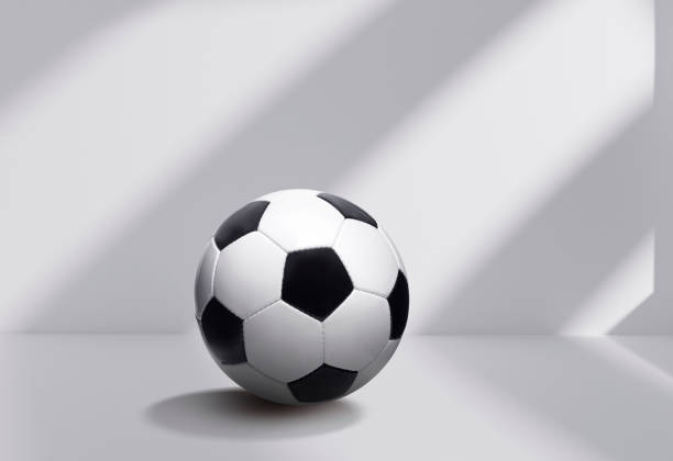 istock Soccer ball on white room background 1427576546