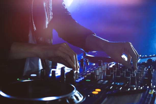 istock DJ creating music on modern console mixer in night club, closeup 1427579839