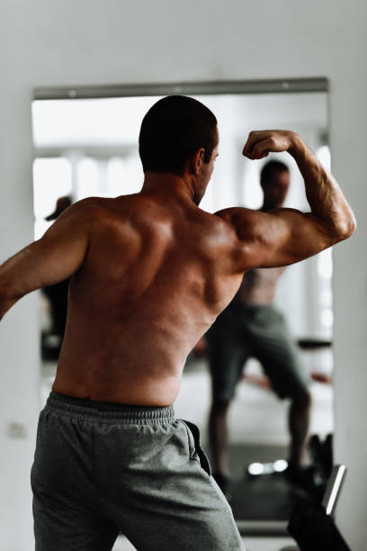 istock Biceps Form By Male Athlete In Gym 1427579953