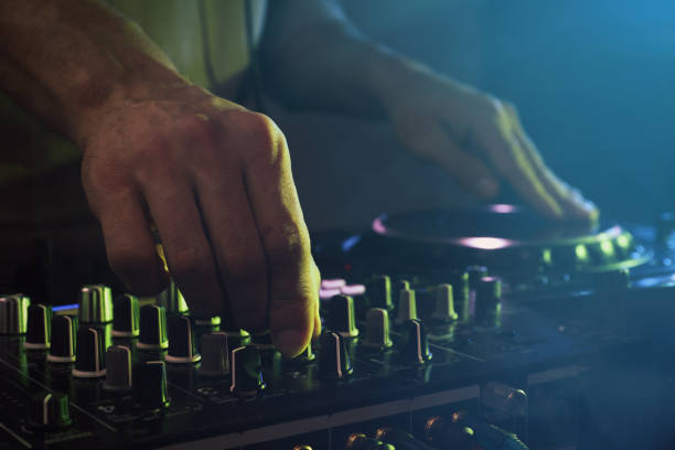 istock DJ creating music on modern console mixer in night club, closeup 1427580610
