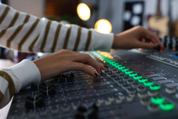 istock Woman working with professional mixing console in modern radio studio, closeup 1427580729