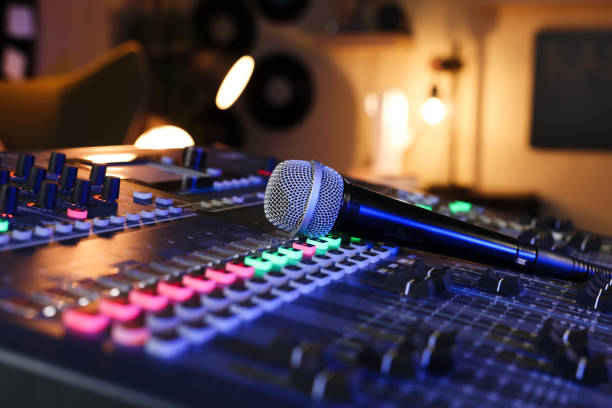 istock Microphone on professional mixing console in radio studio, closeup 1427580773