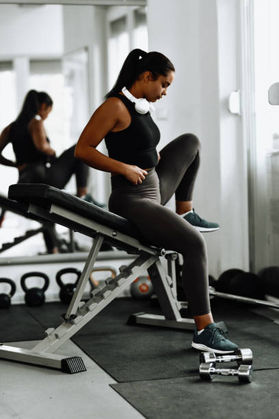 istock Beautiful Athletic Female Checking Feet Position During Tough Workout 1427581441