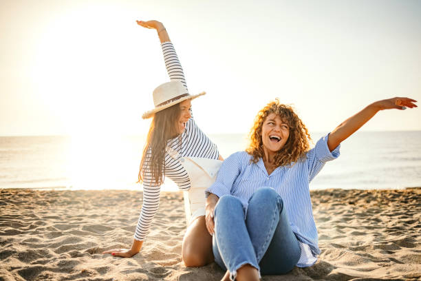 istock Happy girls in summer on beach 1427582036