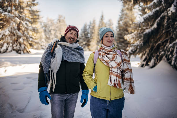 father and daughter hikers - senior adult winter senior women daughter imagens e fotografias de stock