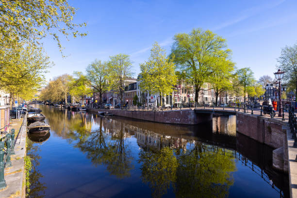 istock Amsterdam view with canal and boats on foreground 1427584617