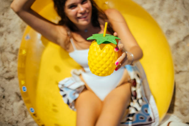 istock Smiling woman on the beach 1427585065