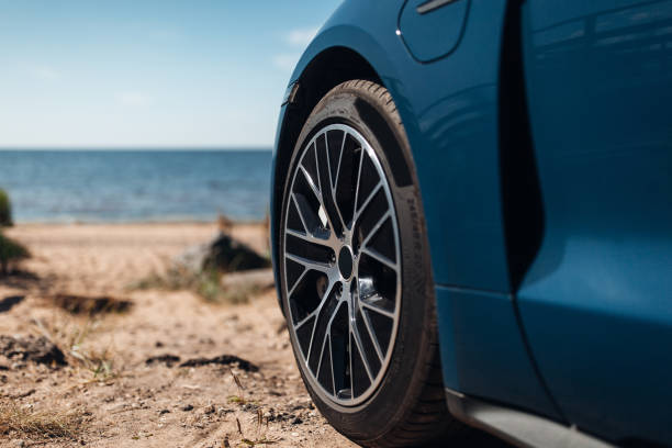 istock Front wheel of car at the beach 1427587511