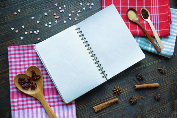istock Recipe book and ingredients for baking on kitchen table. Copy space 1427588051