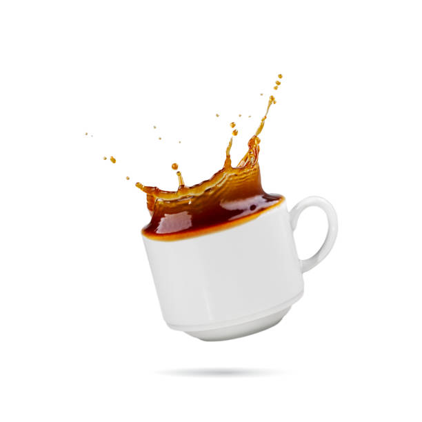 istock Falling coffee cup. Cup of coffee splashes while falling. Splash in white coffee cup. isolated 1427588965