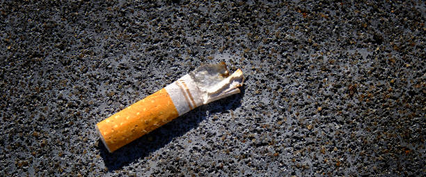 istock Old Cigarette Butt on Concrete Textured Dirty 1427589088