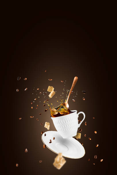 istock Falling coffee cup. Cup of coffee splashes while falling. Splash in white coffee cup. 1427589297