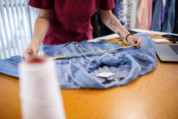 istock Person measuring denim jacket 1427590693