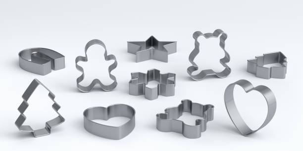 Set of metal cookie cutters for homemade Christmas biscuit on a white background stock photo