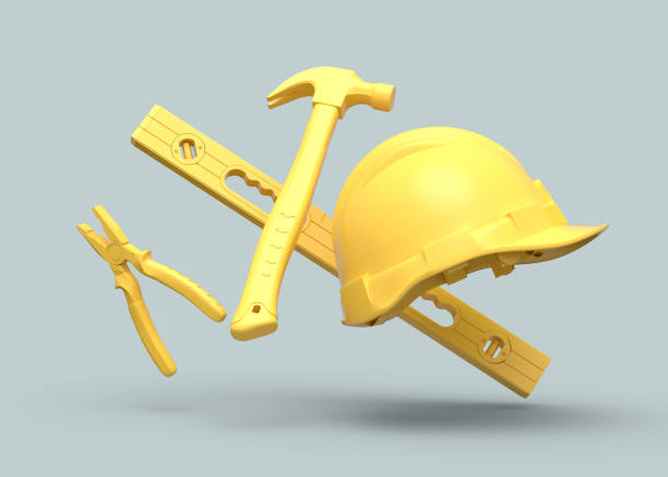 vista voladora de herramientas de construcción amarillas para reparación sobre fondo gris - maintenance engineer work tool hammer instrument of measurement fotografías e imágenes de stock