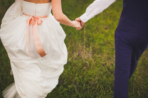 istock The bride and groom hold each other's hands 1427592690