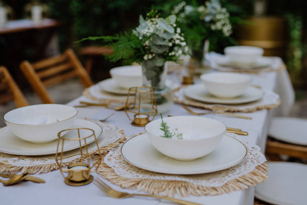 istock High angle view of aesthehic setting wedding table with flowers at backyard. 1427593703