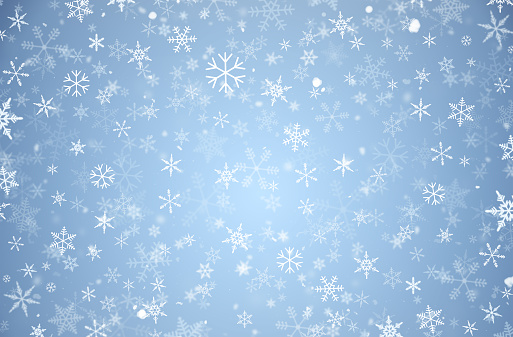 many snowflakes on a light blue background. winter or Christmas background
