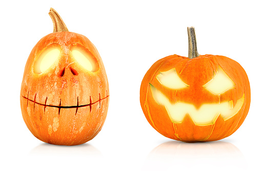 two Jack-o-lanterns from pumpkins for Halloween on a white isolated background