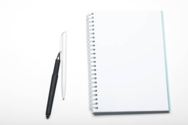 istock notepad notebook and ball pont pen isolated on white background 1427595196