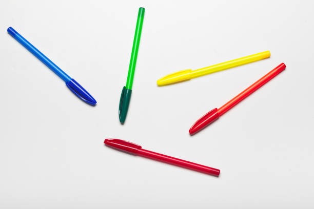 different colors pens isolated on the white background