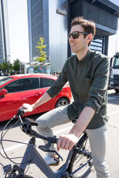 businessman rides e-bike
