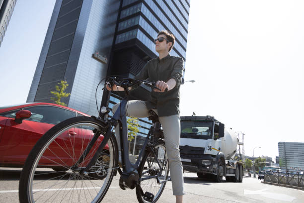 istock businessman rides e-bike 1427595314