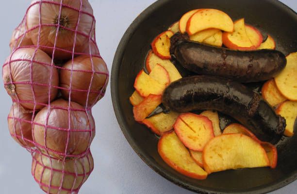 istock Black pudding with onions cooked with sliced apples  French cuisine 1427595686