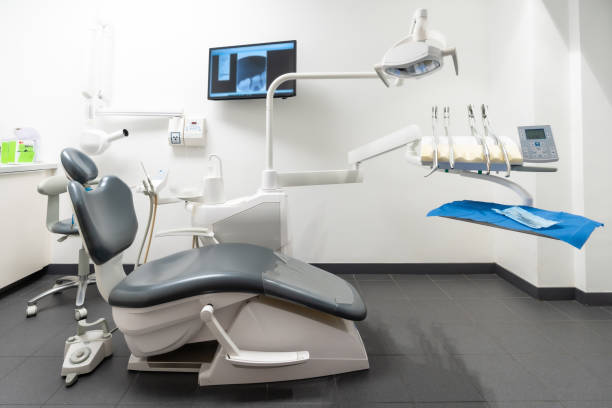 Modern dental practice. Dental chair, medical light, dental clinic without people stock photo