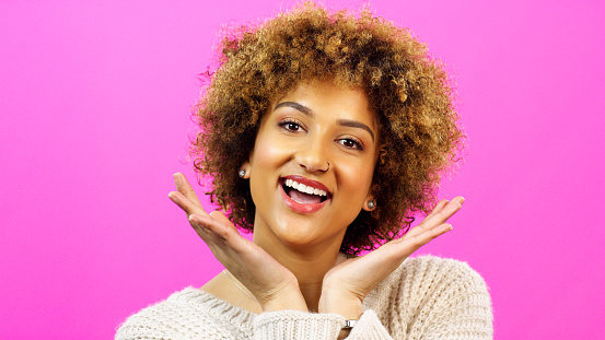 Face portrait, beauty makeup and black woman with smile for fashion, excited about cosmetics and facial skincare against pink mockup studio background. Mock up of African model happy with afro hair