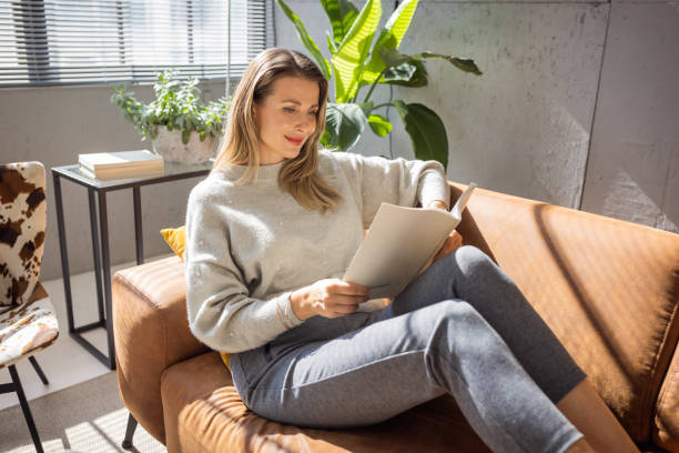 istock Mature woman relaxing on sofa 1427597214