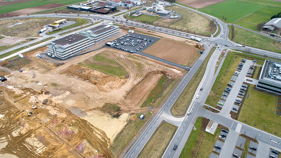Newly built industrial area at Mainz-Hechtsheim, logistics industry buildings and large construction sites - aerial view
