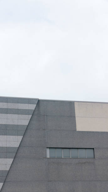 istock Grey office building in industrial area 1427608431