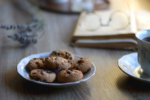 istock Tea, Cookies, Book, Candles and Lavender 1427608532