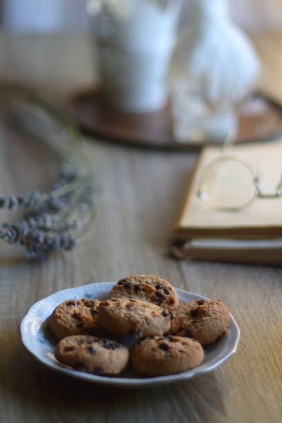 istock Tea, Cookies, Book, Candles and Lavender 1427608533