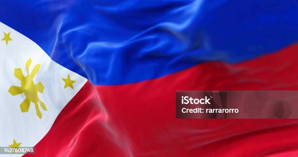 Closeup View Of The Philippines National Flag Waving In The Wind Stock Photo - Download Image Now