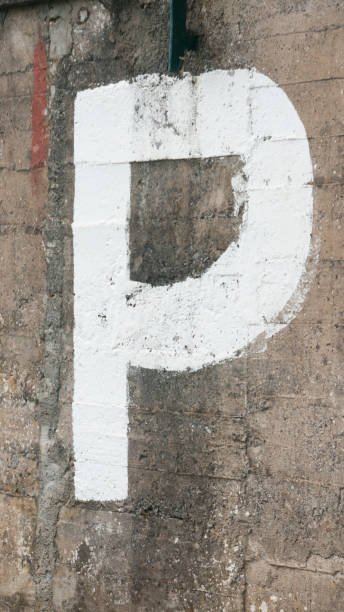 istock White paint letter P in a concrete wall 1427609014