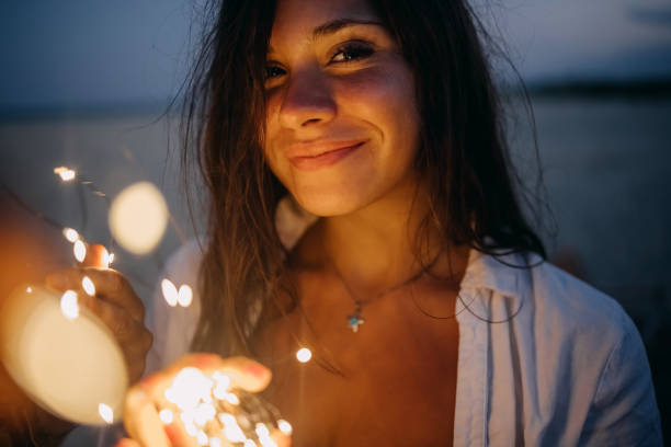 istock Young woman with illumination light 1427611459