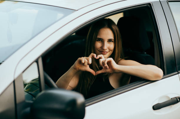 istock Young woman sitting in the car 1427611475