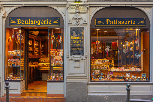 Strasbourg, France - 02.09.2022: Showcase window of bakery store in central Strasbourg with christmas biscuits and breads for sale