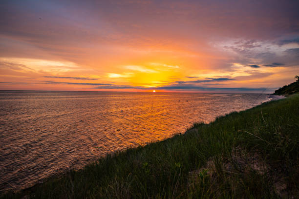 View of a Lake Michigan sunset on a cloudy day from Muskegon State Park in Western Michigan