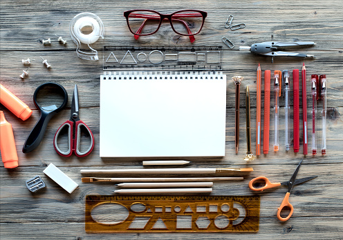 Office or School Supplies on Wooden Rustic Background